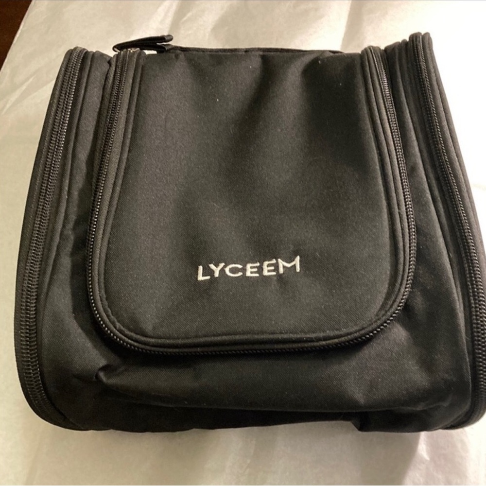 Travel Toiletry Case/Bag Has a hook to hang on bathroom door.